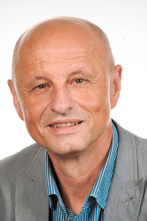 Detlef Rentsch, Glatze, blaues Hemd, graues Jackett